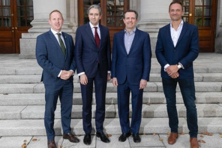 Pictured: Michael Lohan, IDA Ireland; Taoiseach Simon Harris; Hugo Sarrazin, UKG; and Richard Limpki, Immedis